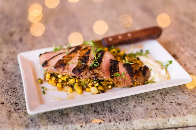 The flat iron pork at Commoner & Co. pairs well with goat cheese mousse and honey.