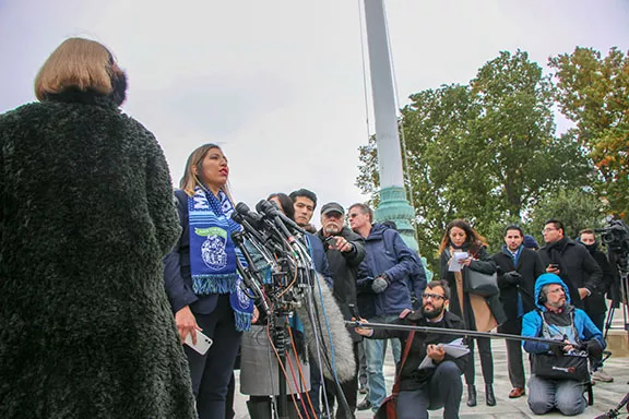 Lindsay Walker/Cronkite News One of the plaintiffs addresses a cheering crowd outside the Supreme Court after it heard arguments over whether the Trump administration can overturn DACA.