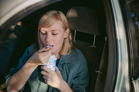 bigstock-girl-eating-ice-cream-with-a-s-150683801.webp