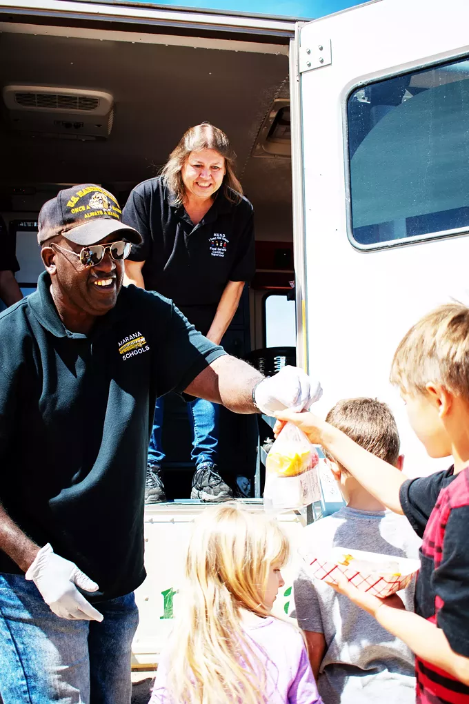 Marana bus driver Alvin Ramsey hands out free meals as part of Marana Cares Mobile
