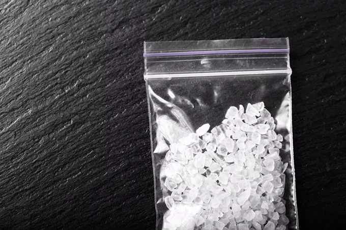 A Taco Bell employee found a clear baggie almost full of a "white crystal-like rocky substance".