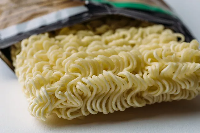 bigstock-dry-instant-noodle-in-plastic--235458313.webp