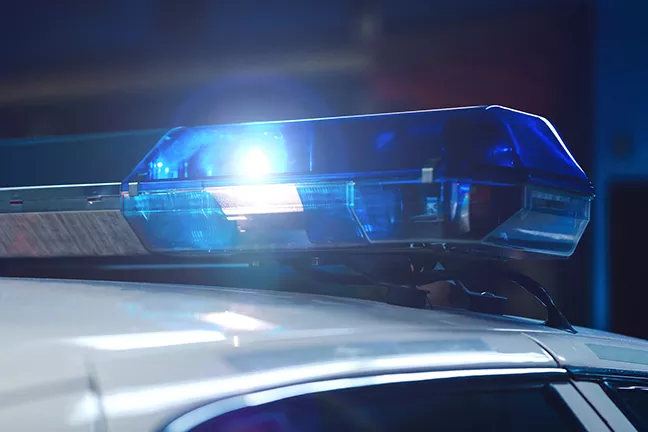 bigstock-police-at-night-in-the-car-wit-236642308.webp