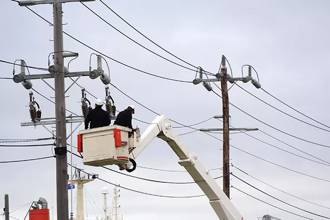 bigstock-workers-cherry-picker-1886281.webp